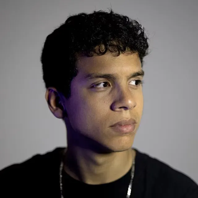 Portrait with smooth, even skin tone after AI retouching